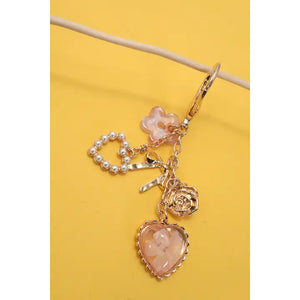 Bag Charm With Pressed Flower, Bow, Pearl and Heart Charms